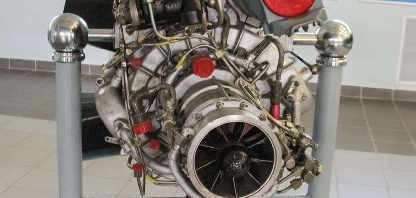 A close-up view of a jet engine mounted on a display stand.