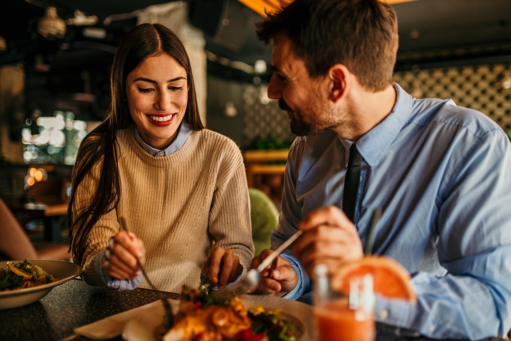 Couple enjoying a meal at great McMinnville restaurants, such as Okta Restaurant